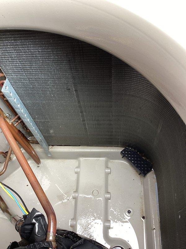 Completed routine preventative maintenance on residential air conditioning system. Performed comprehensive inspection of evaporator coil, condensate drain pan, refrigerant lines, and electrical connections. All components found to be operating within normal parameters with proper drainage function observed. System tested and confirmed operational.