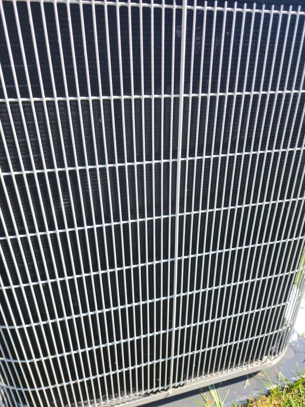 Completed comprehensive cooling system maintenance and tune-up on residential HVAC unit. System was operational upon arrival and confirmed working properly throughout service. Performed standard preventative maintenance procedures including inspection of outdoor condenser unit, verification of proper airflow through protective grille and coil fins, examination of rooftop equipment including condensate drainage system and pump assembly, and testing of all electrical connections and wiring. All components found in satisfactory working condition with no repairs required.