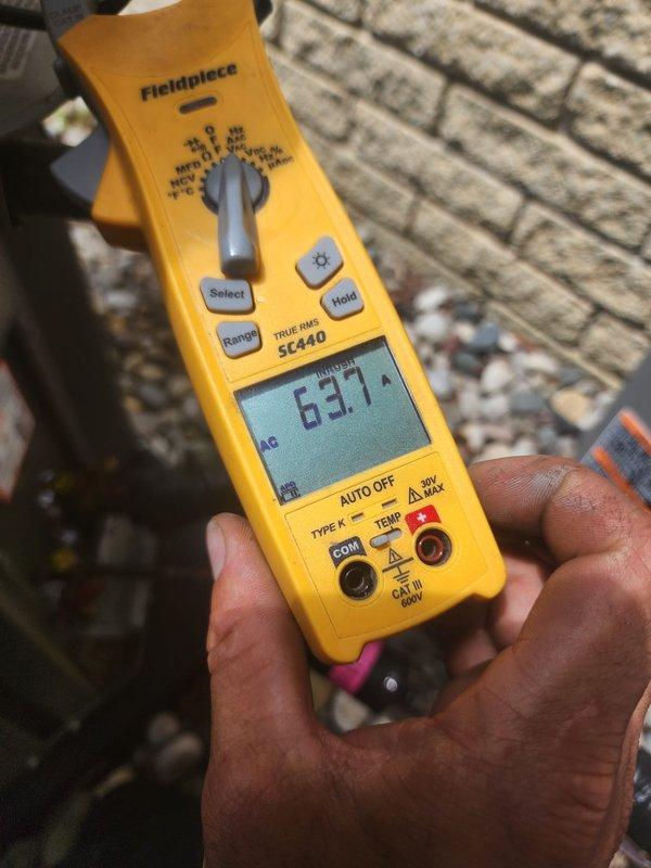 Responded to callback for air conditioning system not cooling. Upon arrival, performed diagnostic testing of system operation and verified temperature differential between supply and return air. Measured supply air temperature at 63.7°F and thermostat reading at 79°F, confirming inadequate cooling performance. Documented system conditions with temperature probes and multimeter readings to verify proper electrical operation and thermal performance of equipment.