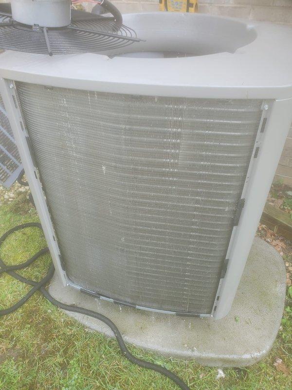 Completed comprehensive cooling system maintenance and renewed service plan at time of visit. Performed standard AC maintenance protocol on outdoor condenser unit, including inspection of exterior housing, filter grille panel, and refrigerant line connections. Inspected indoor HVAC components including refrigerant tubing with visible oxidation pattering, electrical connections, and air distribution vent system. All copper refrigerant lines, electrical wiring bundles, and control connections found to be secure and operational. Unit operating within normal parameters upon completion of maintenance service.
