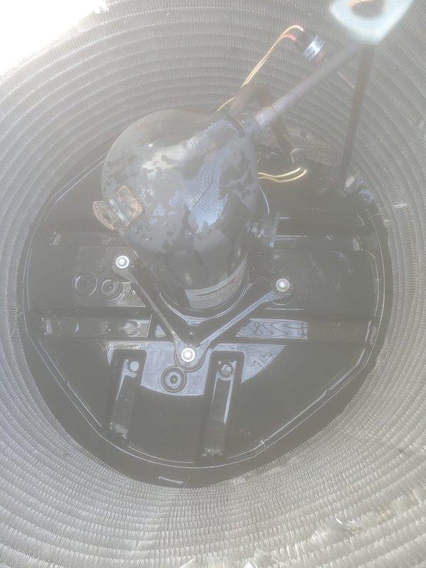 Performed comprehensive preventive maintenance on residential air conditioning system during evening service window. Conducted thorough inspection of evaporator coil assembly, verified refrigerant line connections and insulation integrity, and documented condenser unit operation with protective cover in place. All components found operating within normal parameters with appropriate condensation present on evaporator dome, indicating proper cooling cycle function.