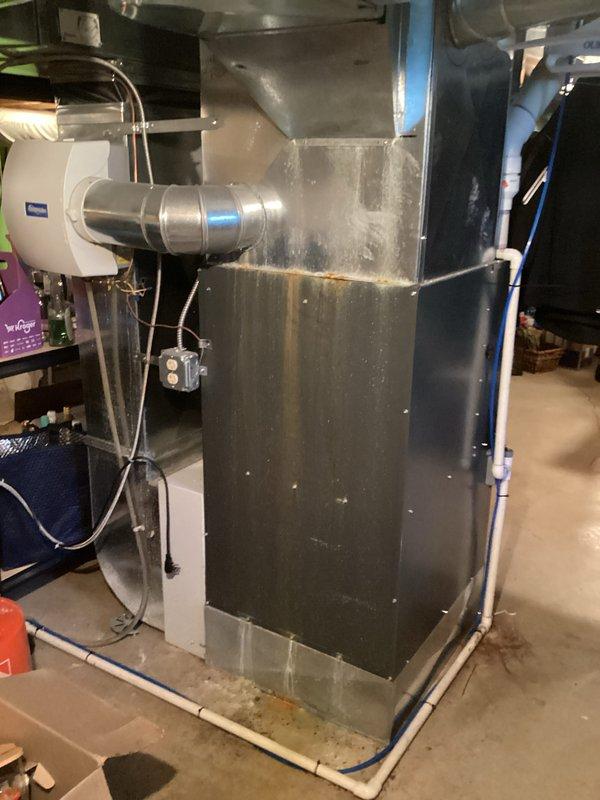 Provided comprehensive estimate for complete HVAC system replacement including 16-year-old air conditioning unit with suspected R-22 refrigerant leak and natural gas furnace with air handler located in basement. Documented existing equipment configuration including ductwork, refrigerant lines, condensate drainage system, and electrical connections to prepare detailed replacement proposal for both heating and cooling systems.