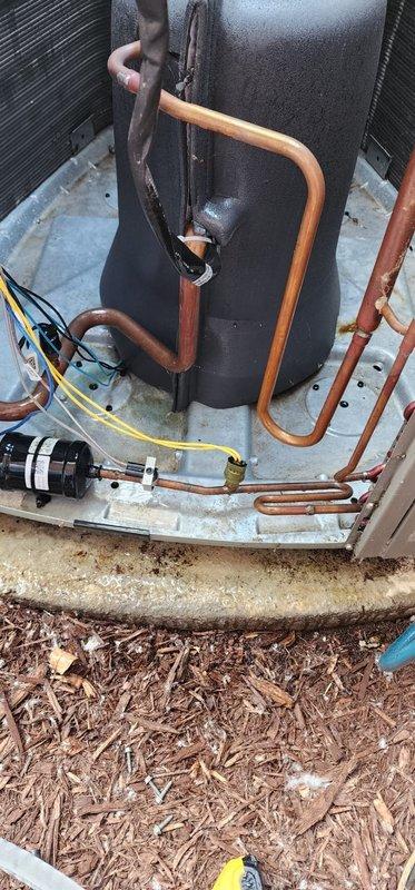 # HVAC Maintenance - Cooling System Service

Completed comprehensive preventive maintenance and tune-up on outdoor cooling unit. Performed standard seasonal inspection including cleaning of condenser coils, verification of refrigerant lines and connections, electrical component testing, and system operational checks. Unit confirmed operational and running within normal parameters; debris removed from base area and mulch cleared from around equipment to ensure proper airflow and drainage.