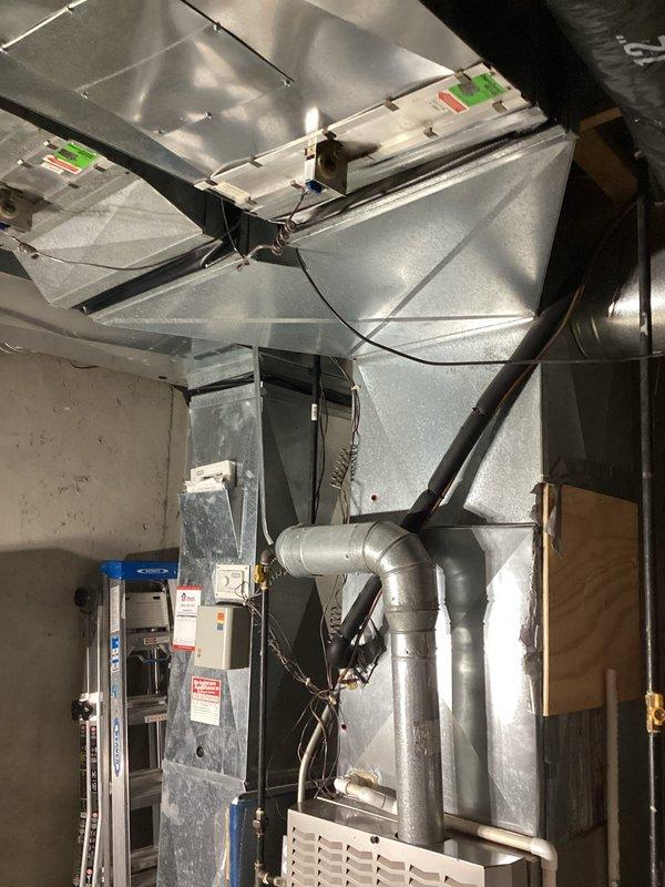 Provided comprehensive estimate for air conditioning system replacement on 20-year-old unit currently in working condition. Evaluated existing HVAC equipment located in basement mechanical room, including furnace with natural gas fuel source, ductwork configuration, and electrical connections. Documented equipment specifications, spatial requirements, and existing infrastructure to prepare detailed replacement options for aging AC system.