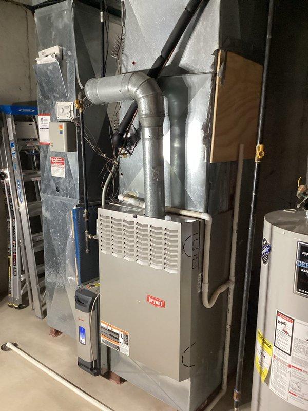 Provided comprehensive estimate for air conditioning system replacement on 20-year-old unit currently in working condition. Evaluated existing HVAC equipment located in basement mechanical room, including furnace with natural gas fuel source, ductwork configuration, and electrical connections. Documented equipment specifications, spatial requirements, and existing infrastructure to prepare detailed replacement options for aging AC system.