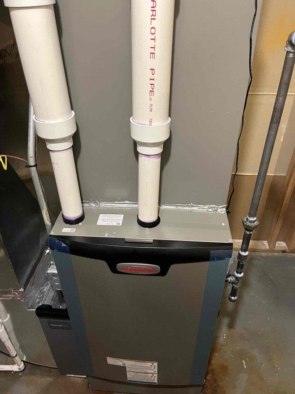 Completed full HVAC system installation including new furnace unit with dual PVC venting system and Lennox S40 Smart Thermostat. All equipment installed to manufacturer specifications with proper venting, refrigerant lines, and electrical connections verified and operational.