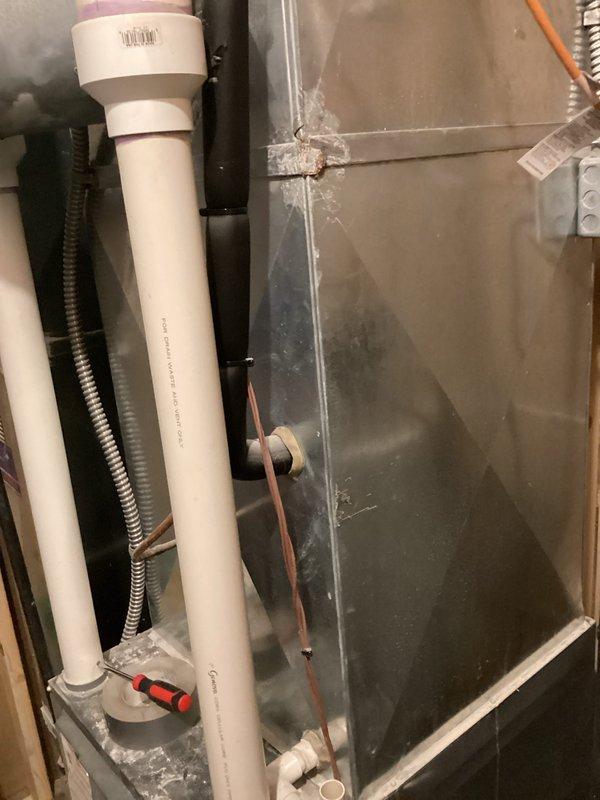 Completed furnace replacement estimate at residential property. Evaluated existing HVAC system installation in basement utility area, including assessment of current ductwork configuration, PVC condensate drain lines, electrical conduit routing, and copper refrigerant line connections. Documented system components and infrastructure with photographs to provide comprehensive replacement recommendations and equipment sizing requirements for customer consideration.