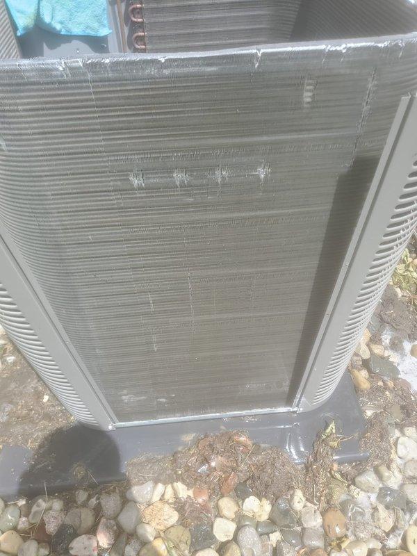 Completed routine AC tune-up on 5-year-old outdoor condensing unit located on west side of property. Performed standard maintenance including coil cleaning, refrigerant line inspection, and system performance evaluation. Noted frost buildup on condenser coil and refrigerant lines during operation, indicating possible low refrigerant charge or restricted airflow requiring future attention. System operational at time of departure but recommend follow-up service to address icing condition.