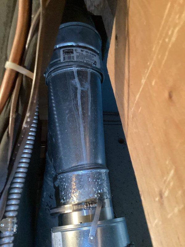 Completed final mechanical inspection and warranty work for furnace and humidifier replacement installation. Verified and corrected all furnace exhaust vent pipe clearances to meet code requirements, ensuring single wall vent pipe maintains 6 inches from combustible materials and double wall vent pipe maintains 1 inch from combustible materials. Documented measurements and system configuration with photos for compliance verification.