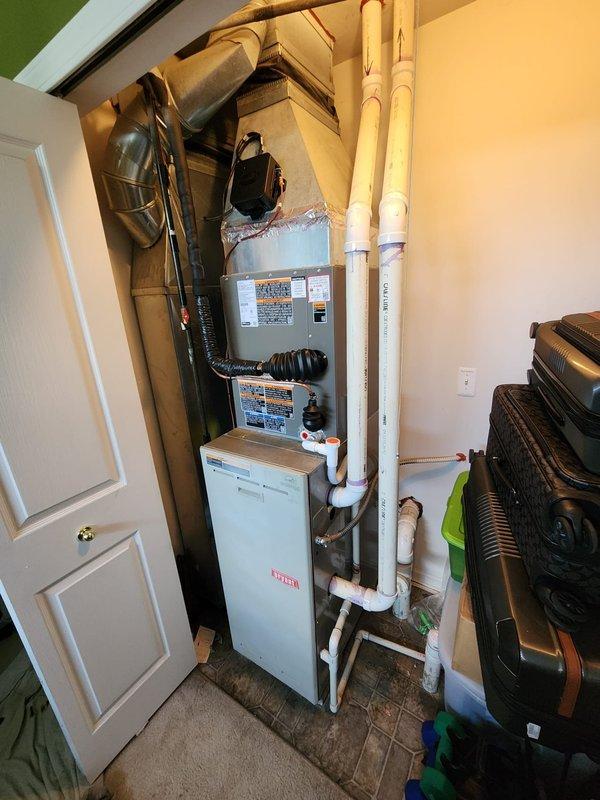 Completed installation of Lennox air conditioning system at residential property. New AC unit was installed and connected to existing Bryant furnace in utility closet, with refrigerant lines and electrical connections properly configured. All components were tested for proper operation, and photographic documentation was captured for completion certification purposes.