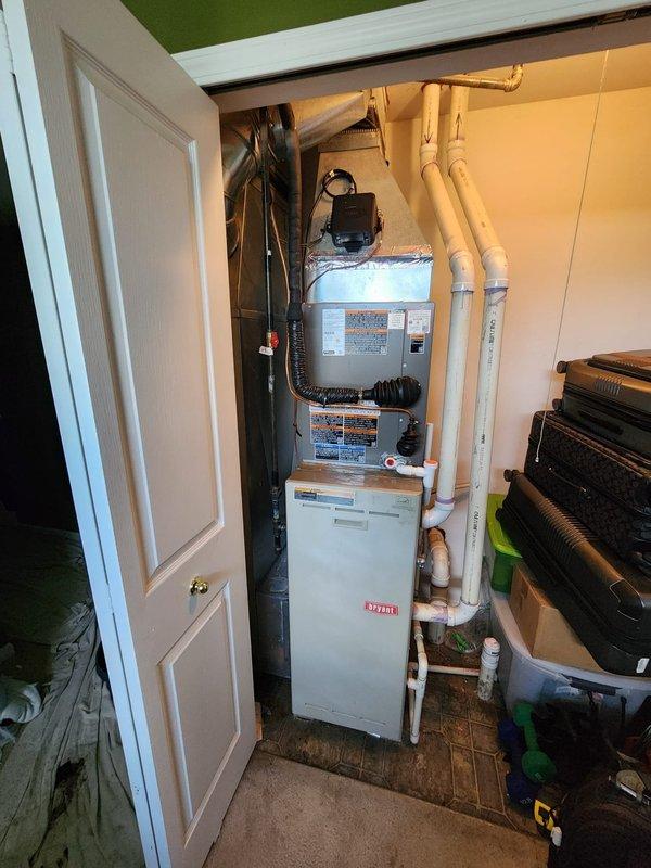 Completed installation of Lennox air conditioning system at residential property. New AC unit was installed and connected to existing Bryant furnace in utility closet, with refrigerant lines and electrical connections properly configured. All components were tested for proper operation, and photographic documentation was captured for completion certification purposes.