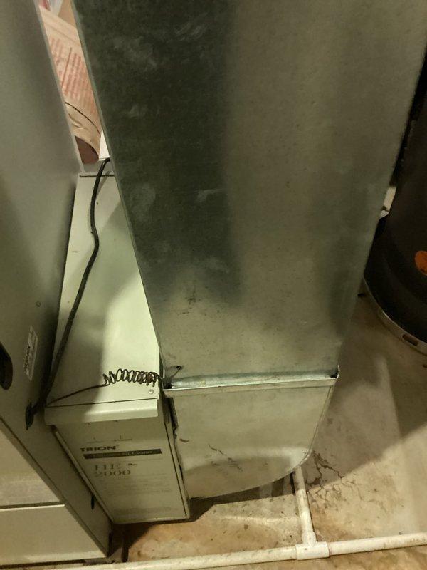 Conducted estimate for replacement of 15-year-old R22 air conditioning system experiencing refrigerant leak. Unit controls upstairs zone and has reached end of serviceable life due to age and obsolete refrigerant type. Documented existing HVAC installation including air handler, ductwork, and furnace configuration in basement utility area. Assessed current system layout and provided replacement recommendations for complete AC system upgrade to comply with current refrigerant standards.