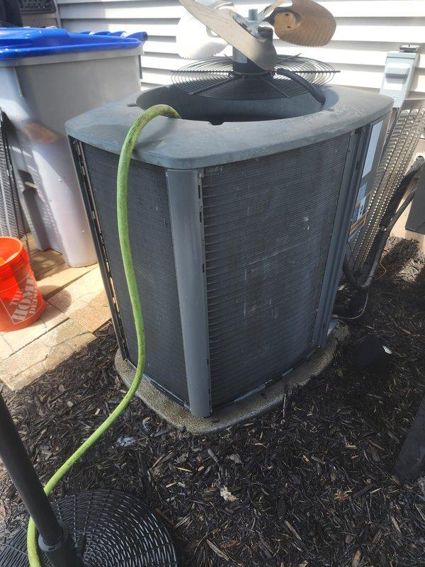 Responded to no-cooling complaint on residential air conditioning system. Upon inspection, found 10+ year old unit with evaporator coil and condenser requiring assessment. Performed system diagnostics including refrigerant level check, electrical connections inspection, and airflow evaluation. Cleaned condenser unit exterior and documented equipment condition with photos showing internal evaporator coil assembly and outdoor condenser unit configuration for customer records and future service recommendations.