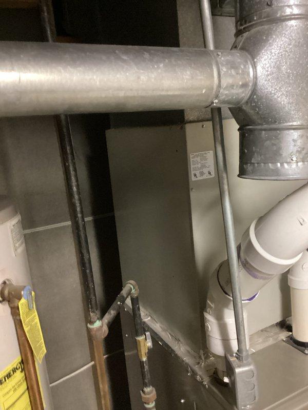 Responded to service call for residential air conditioning system that ceased operation over the weekend. Upon inspection, determined existing unit was over 20 years old with failed capacitor or seized fan motor. Conducted comprehensive assessment of current HVAC system including Bryant furnace and associated ductwork in basement utility area. Provided detailed replacement estimate for new air conditioning system to restore cooling capacity to the residence.