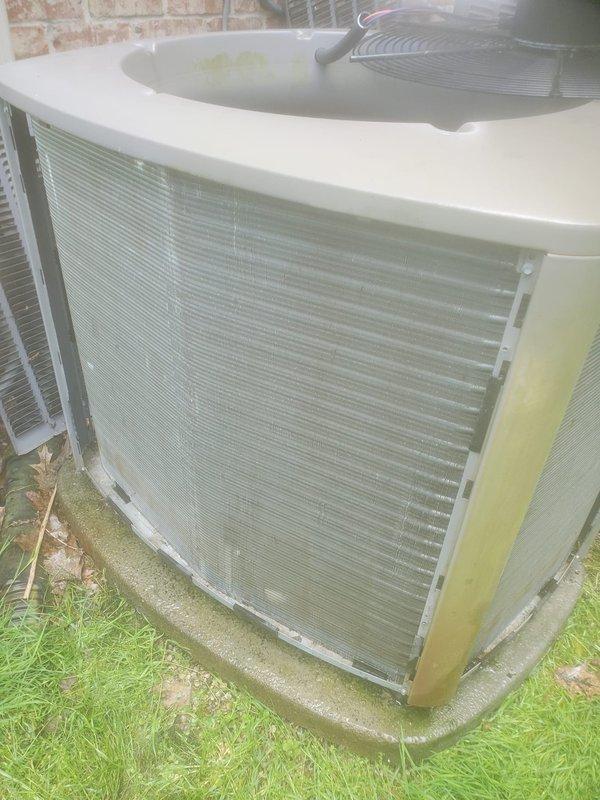 Completed preventive maintenance on dual air conditioning system. Upon inspection, discovered significant ice accumulation on evaporator coil and drain pan in one unit, indicating restricted airflow or potential refrigerant issue requiring further diagnosis. Exterior condenser unit shows weathering and discoloration consistent with age but remains operational. Customer advised to schedule next maintenance appointment and confirm preferences for coordinating water heater, humidifier, and generator maintenance with furnace service.