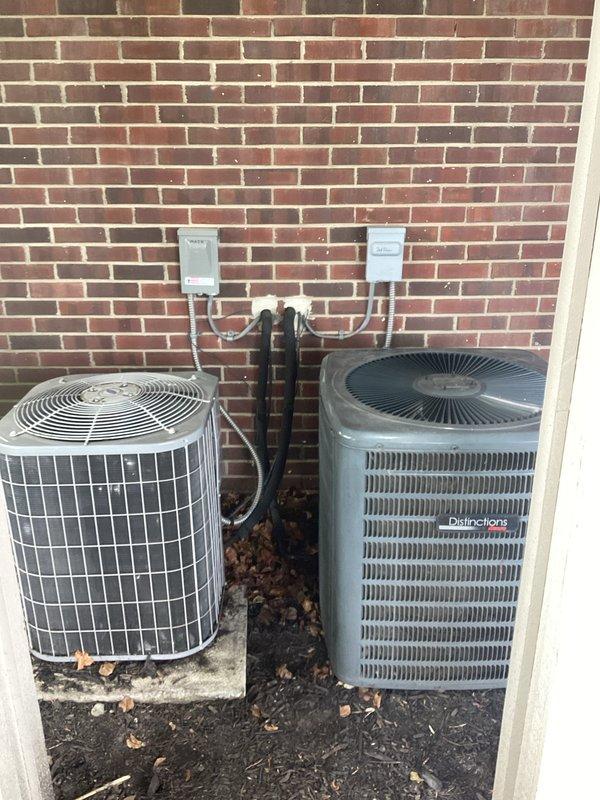 Completed comprehensive estimate for replacement of dual air conditioning system with zoning capabilities serving three zones. Evaluated existing outdoor condenser units positioned against exterior brick wall, including assessment of refrigerant line routing, electrical disconnects, and equipment placement on concrete pads. Assessed indoor air handling equipment consisting of two vertical furnace/air handler units in basement mechanical room, including evaluation of existing ductwork configuration, PVC condensate drainage system, and electrical connections. Documented current system specifications and photographed equipment for replacement proposal development.