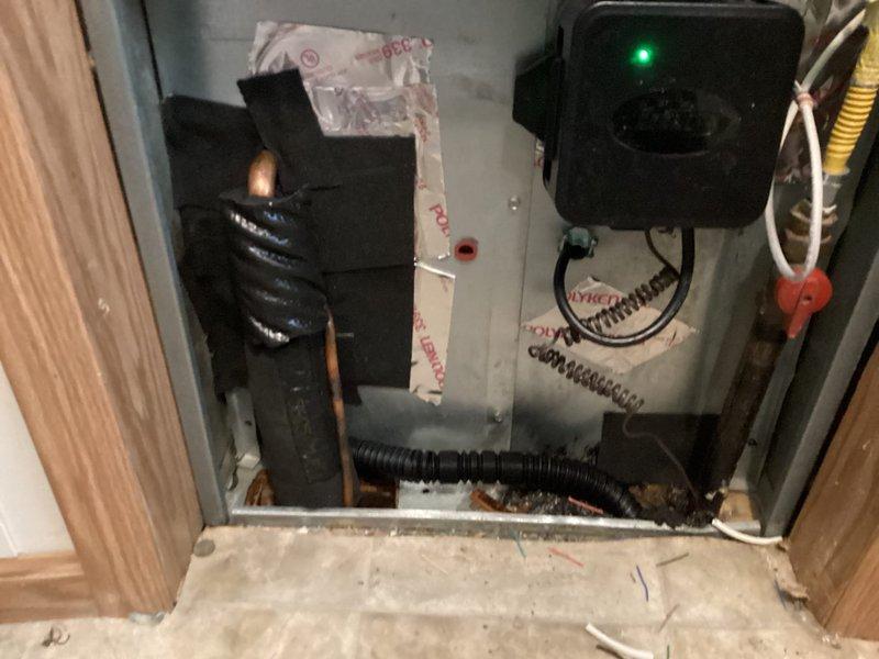 Completed installation of Lennox air conditioning system in mobile home, including new outdoor condensing unit, indoor air handler with evaporator coil, refrigerant line set, condensate drain line, electrical connections, and LUXPRO digital thermostat. System was tested, charged to manufacturer specifications, and verified operational with all components functioning properly.