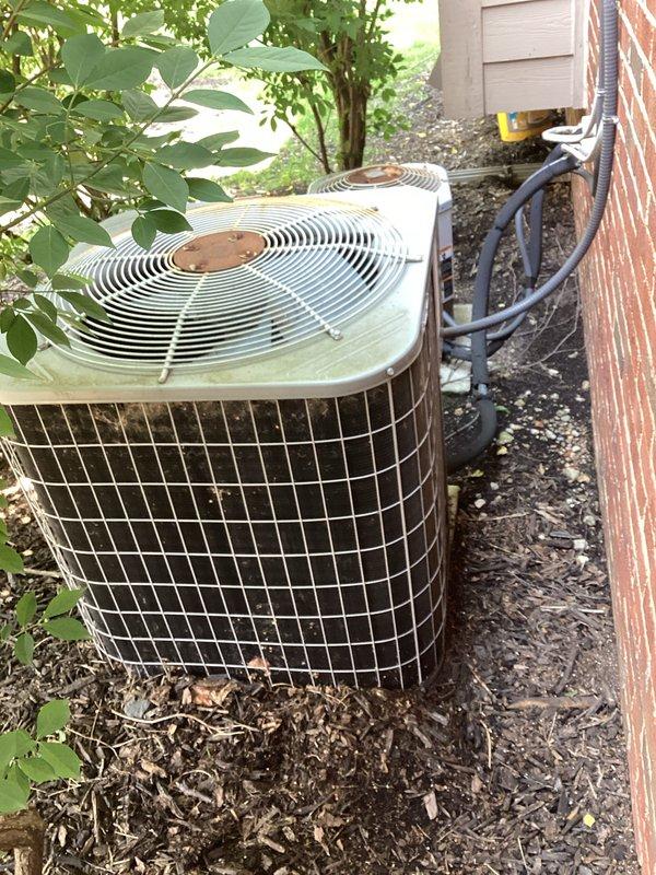 Conducted comprehensive assessment of twenty-year-old outdoor air conditioning system experiencing compressor failure while unit continues to operate. Evaluated existing equipment configuration including exterior condenser unit positioned in backyard side yard area with protective wire mesh cage, associated refrigerant line routing, electrical disconnect, and indoor air handler with ductwork connections in basement utility space. Provided detailed replacement estimate for new air conditioning system to restore full cooling capacity and improve operational efficiency.