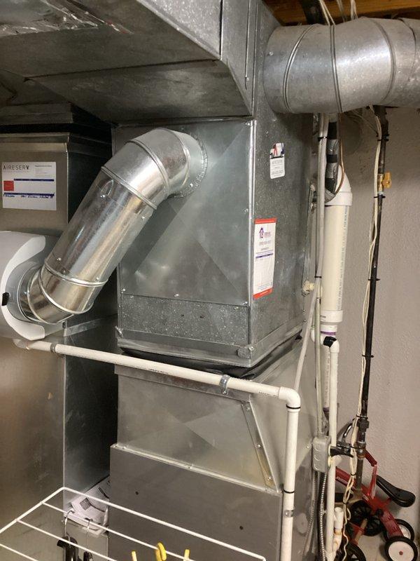 Completed estimate for HVAC system replacement due to low refrigerant R-22 charge in existing air conditioning unit. Documented current equipment condition including air handler, ductwork, and condensate drainage system in basement mechanical room. Provided replacement options for aging system utilizing obsolete R-22 refrigerant.