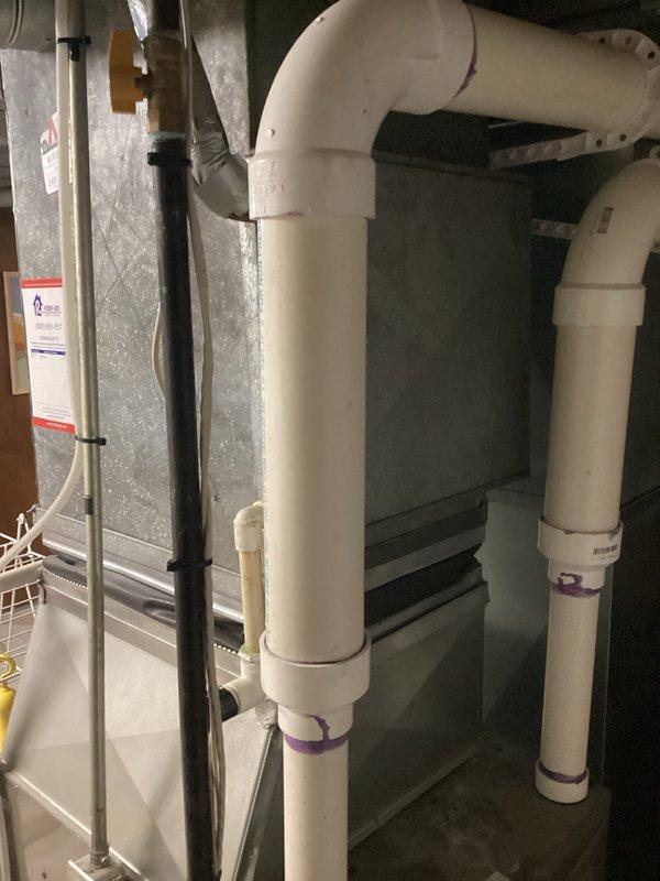 Completed estimate for HVAC system replacement due to low refrigerant R-22 charge in existing air conditioning unit. Documented current equipment condition including air handler, ductwork, and condensate drainage system in basement mechanical room. Provided replacement options for aging system utilizing obsolete R-22 refrigerant.