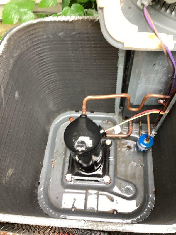 Responded to service call for non-operational air conditioning unit with reported pink fluid leak. Upon inspection, identified contaminated condensate drain system causing colored discharge. Cleaned condenser coil fins, cleared drain line obstruction, verified compressor operation, tested capacitor functionality, and confirmed system returned to normal cooling operation with proper drainage.