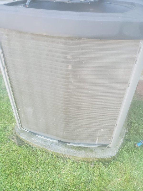 Completed routine maintenance on residential cooling system. Inspected outdoor condenser unit, noting operational fins and coils with minor dirt accumulation at base requiring standard cleaning. Verified indoor air handler components including condensate drain pan and float switch assembly, confirming proper water drainage and switch functionality with no blockages detected.