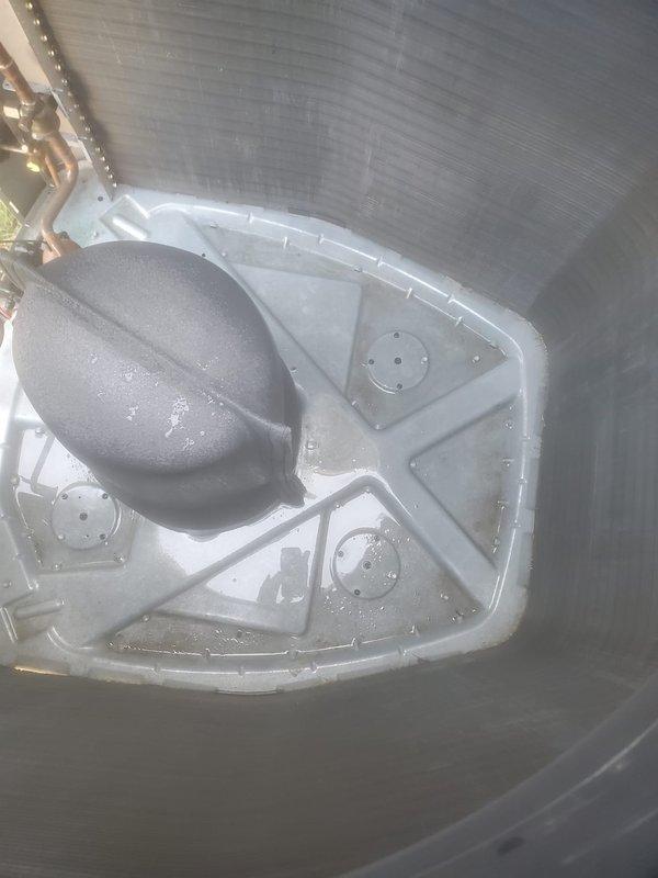 Completed routine maintenance on residential cooling system. Inspected outdoor condenser unit, noting operational fins and coils with minor dirt accumulation at base requiring standard cleaning. Verified indoor air handler components including condensate drain pan and float switch assembly, confirming proper water drainage and switch functionality with no blockages detected.
