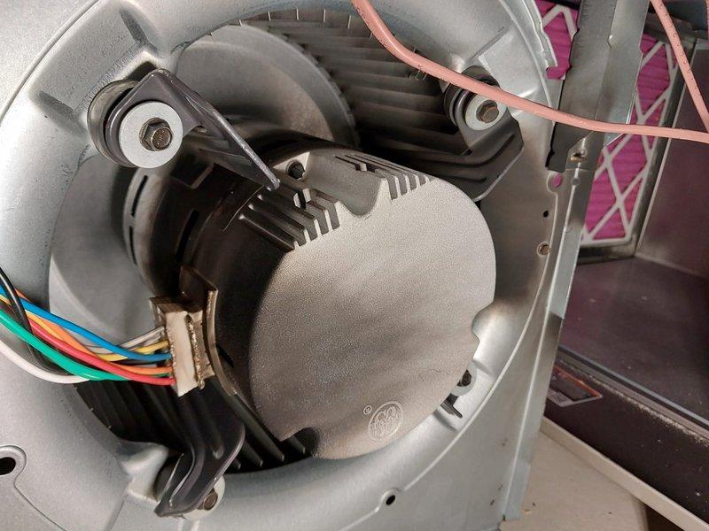 Responded to no-airflow complaint on 3-year-old residential AC system. Upon arrival, confirmed outdoor condensing unit was operating but no air distribution throughout home. Inspected Bryant furnace/air handler in basement and diagnosed failed blower motor. Blower motor was not energizing despite proper voltage supply to unit. Removed blower assembly from air handler cabinet, confirmed motor failure through continuity testing and visual inspection. Replaced defective blower motor with OEM equivalent replacement, reconnected all electrical connections, and reinstalled blower assembly into furnace housing. Verified proper motor operation, confirmed adequate airflow through supply registers, and tested system through complete cooling cycle. System restored to normal operation with proper airflow distribution throughout residence.