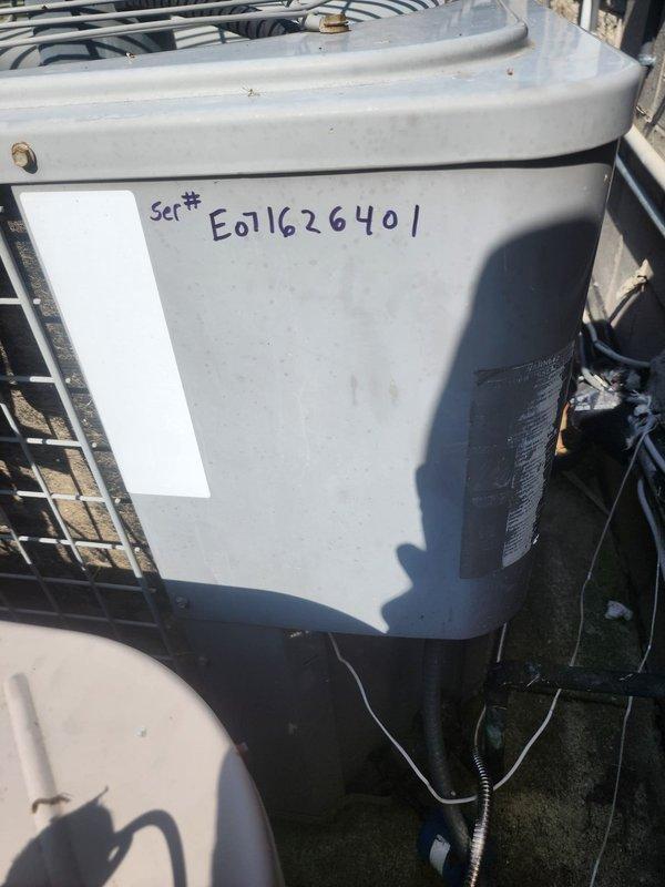 Responded to service call for second floor unit leaking water through ceiling into bathroom below. Located and documented affected HVAC system via exterior disconnect box marked "2nd Floor Service" and outdoor condensing unit with serial number E01162640I. Photographed equipment for service records and further diagnostic evaluation of water leak source.