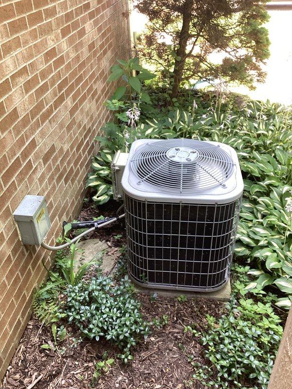 Provided comprehensive estimate for replacement of 20-year-old residential air conditioning system currently experiencing performance issues. Evaluated existing outdoor condensing unit located in landscaped area on concrete pad with electrical disconnect, assessed electrical panel configuration, and documented equipment specifications and site conditions to prepare replacement recommendations for aging HVAC system operating below optimal capacity.