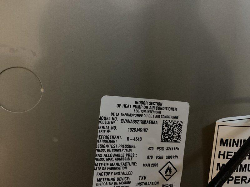 Successfully installed a new Bryant air conditioning system, including the indoor air handler unit (Model CVAVA3621XMAABAA) and outdoor condensing unit. The indoor section was configured as part of a heat pump or air conditioner system utilizing R-454B refrigerant with a TXV metering device. Completed all refrigerant line connections using properly insulated copper piping, installed brass service valves with isolation capabilities, established condensate drainage via PVC piping, and verified all pressure ratings meet manufacturer specifications. System was installed on a concrete pad with secure mounting and all electrical connections completed per code requirements.