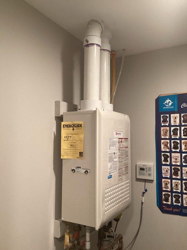 Responded to service call for tankless water heater with internal valve leak. Upon inspection, identified leaking internal valve requiring replacement and provided estimate for repair. Documented existing installation including ventilation system, plumbing connections, and associated water treatment equipment for customer records.