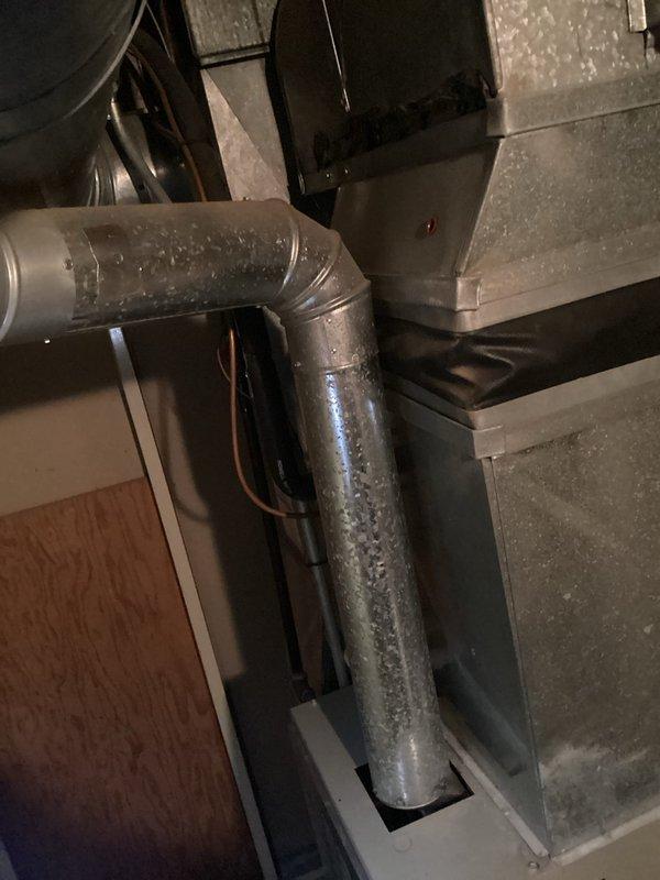 Performed comprehensive assessment of existing HVAC system for replacement estimate due to failed compressor and deteriorated equipment condition. Evaluated air handler unit in attic space showing significant condensation accumulation on cabinet and connected ductwork, indicating potential insulation deficiencies and system inefficiencies. Inspected basement mechanical equipment including furnace/air handler with aging copper refrigerant lines displaying oxidation and compression fittings with visible wear. Documented extensive moisture presence on metal surfaces and assessed overall system age and condition rating of 2-4, confirming replacement recommendation over repair due to compressor failure and compromised equipment integrity. Photographed existing installation configuration, ductwork routing, and component conditions to support replacement proposal specifications.