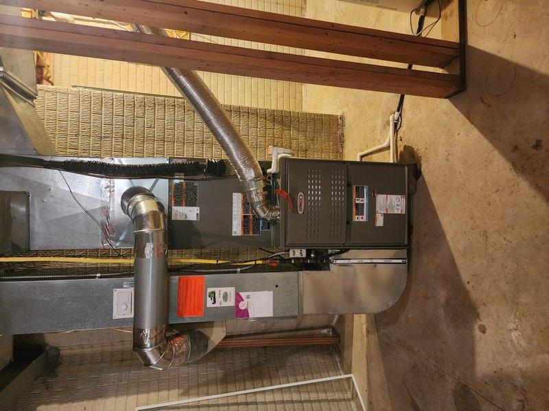Completed full HVAC system installation including new Lennox 80% efficiency furnace and air conditioning unit with replacement of refrigerant line-set. Both units were installed in basement mechanical room with proper venting, condensate drainage via PVC piping, electrical connections, and flexible ductwork integration to existing distribution system. All components tested and operational upon completion.