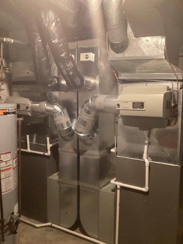 Completed air conditioning replacement estimate for residential HVAC system. Documented existing equipment configuration including furnace/air handler unit, ductwork layout, and associated components to provide replacement options excluding Lennox brand per customer preference.