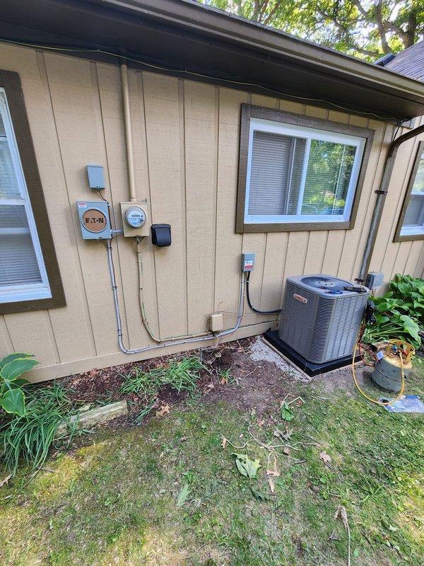 Successfully installed new Lennox air conditioning system with interruptible power configuration as specified. Reinstalled existing humidifier onto the return air ductwork to maintain whole-home humidity control. All electrical connections completed with weatherproof outdoor junction box, proper conduit routing, and secure mounting on exterior wall. Unit positioned on level concrete pad with appropriate clearances for optimal airflow and service access. System tested and operational.