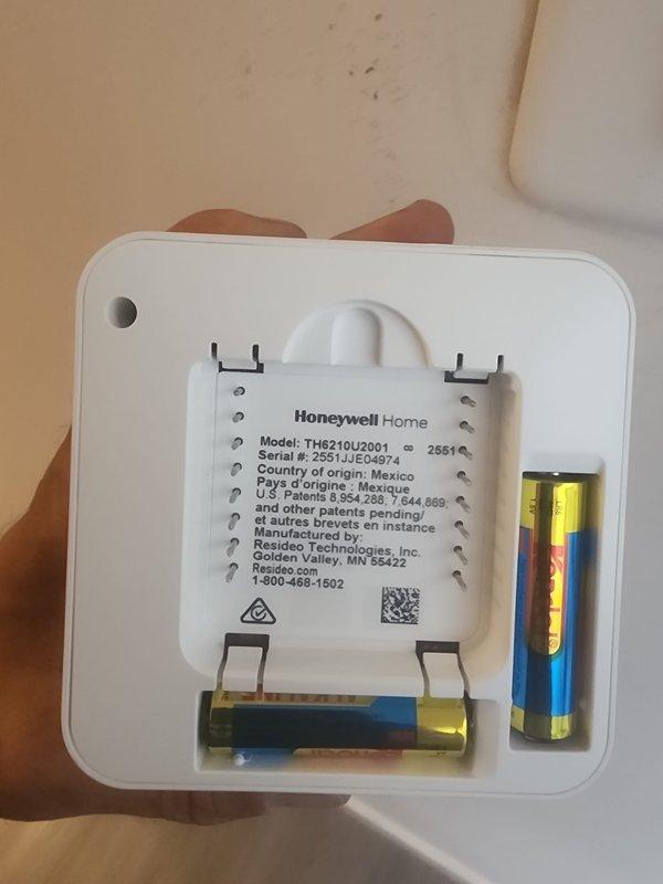 Responded to no cooling callback after recent thermostat replacement. Upon arrival, verified Honeywell Home TH6210U2001 thermostat installation and confirmed unit operational with 2.2°F temperature differential between thermostat reading (75°F) and handheld thermometer measurement (72.8°F), which is within normal calibration tolerance. Documented thermostat model information and battery installation, system cycling properly in cooling mode.