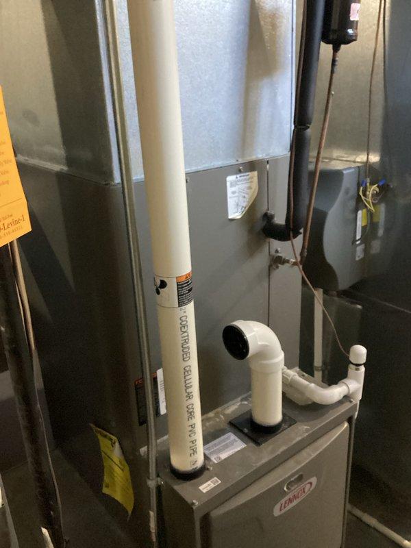 Provided comprehensive estimate for complete HVAC system replacement including furnace and air conditioning equipment. Existing 15-year-old Lennox natural gas furnace and associated system components currently operational but nearing end of service life. Assessed mechanical room installation with existing PVC venting configuration, ductwork connections, and clearance requirements for new equipment specifications.