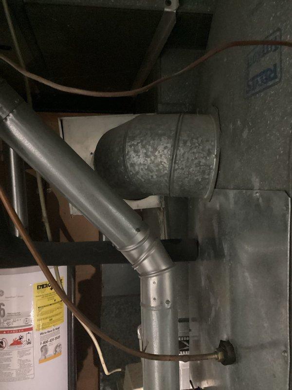 Conducted comprehensive replacement estimate for 35-year-old residential air conditioning system serving master bedroom and bathroom zone. Unit currently operational but exhibiting declining cooling performance, particularly during peak demand periods, with minimal maintenance history over its service life. Inspected interior mechanical components, refrigerant lines, and evaporator coil assembly. Evaluated aged ductwork system showing significant weathering and corrosion on transition components. Assessed copper refrigerant tubing routing and connections throughout mechanical space. Property has two separate AC systems (35 and 32 years old respectively), with homeowner seeking professional replacement recommendations and competitive options for the underperforming unit. Recent temporary repairs performed by another contractor prior to estimate request. Provided technical assessment and replacement options for aging equipment that has exceeded typical service life expectancy.