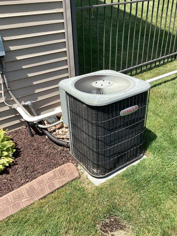 Conducted on-site assessment of existing HVAC system and water heater in 20-year-old residential property to provide replacement quotation. Inspected furnace unit located in basement utility room, noting ENERGUIDE labeling and connected PVC condensate drainage system with associated ductwork and evaporator coil assembly. Evaluated outdoor Lennox condensing unit positioned on concrete pad with refrigerant line connections to building, verifying operational configuration and installation parameters. Examined water heater unit positioned in basement corner adjacent to heating equipment. Documented existing equipment specifications, installation locations, and mechanical room layout through photographic records. Assessed accessibility for future equipment replacement, including clearance requirements, utility connections, venting configurations, and electrical service provisions. Reviewed overall system age and provided comprehensive replacement recommendations for all three units based on
