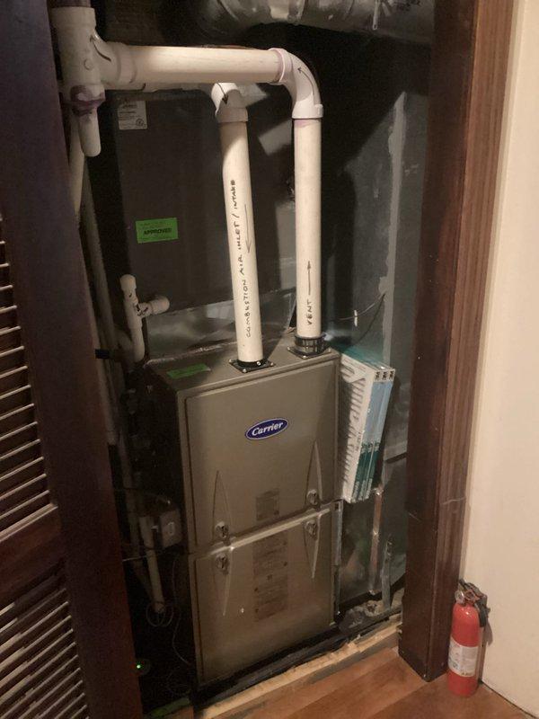Conducted replacement estimate for 22-year-old Carrier HVAC system utilizing R22 refrigerant currently installed in utility closet. Evaluated existing furnace and air conditioning unit configuration, documented equipment condition and installation setup including PVC condensate drainage and venting system, and provided comprehensive assessment for complete system replacement due to age and obsolete refrigerant type.