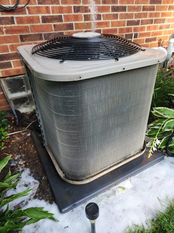 Performed comprehensive preventive maintenance on a 10-year-old outdoor air conditioning system per active membership agreement. Conducted complete system inspection including visual examination of condensing unit exterior housing, condenser coil fins, compressor assembly, refrigerant line connections, and electrical components. Verified proper operation of condenser fan motor and checked fan guard integrity. Inspected copper refrigerant tubing for signs of wear, damage, or leaks. Examined compressor unit mounted in condensate drain pan, noting all electrical connections and safety controls. Assessed condition of filter drier and refrigerant circuit components. Cleared debris from around unit base and verified adequate clearance for proper airflow. All components found operating within normal parameters with no immediate service needs identified. System ready for continued operation through cooling season.