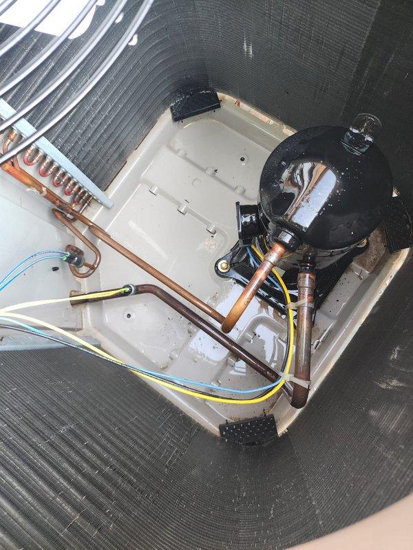 Performed comprehensive preventive maintenance on a 10-year-old outdoor air conditioning system per active membership agreement. Conducted complete system inspection including visual examination of condensing unit exterior housing, condenser coil fins, compressor assembly, refrigerant line connections, and electrical components. Verified proper operation of condenser fan motor and checked fan guard integrity. Inspected copper refrigerant tubing for signs of wear, damage, or leaks. Examined compressor unit mounted in condensate drain pan, noting all electrical connections and safety controls. Assessed condition of filter drier and refrigerant circuit components. Cleared debris from around unit base and verified adequate clearance for proper airflow. All components found operating within normal parameters with no immediate service needs identified. System ready for continued operation through cooling season.