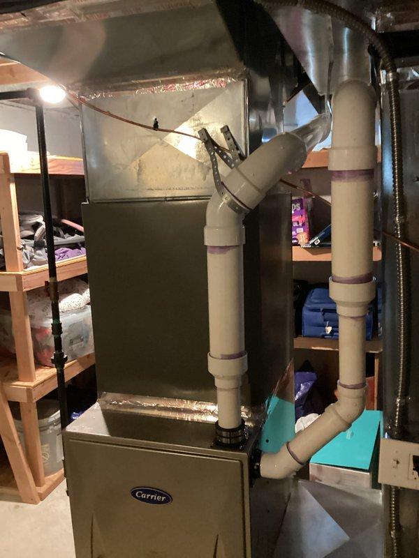 Provided estimate for replacement of 21-year-old air conditioning system with suspected refrigerant leak. Current Carrier furnace and ductwork system evaluated in basement location, with unit currently operational but showing signs of declining efficiency. Reviewed equipment specifications, assessed existing installation configuration including plenum connections and drainage systems, and documented current system condition to prepare comprehensive replacement recommendations.