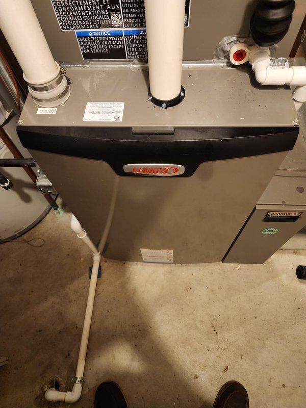 Completed installation of Lennox air conditioning system including new air handler unit in basement utility area. Verified all supply vents throughout home were open and operational, adjusted blower fan settings as needed, and performed static pressure testing to ensure proper airflow and system performance within manufacturer specifications.