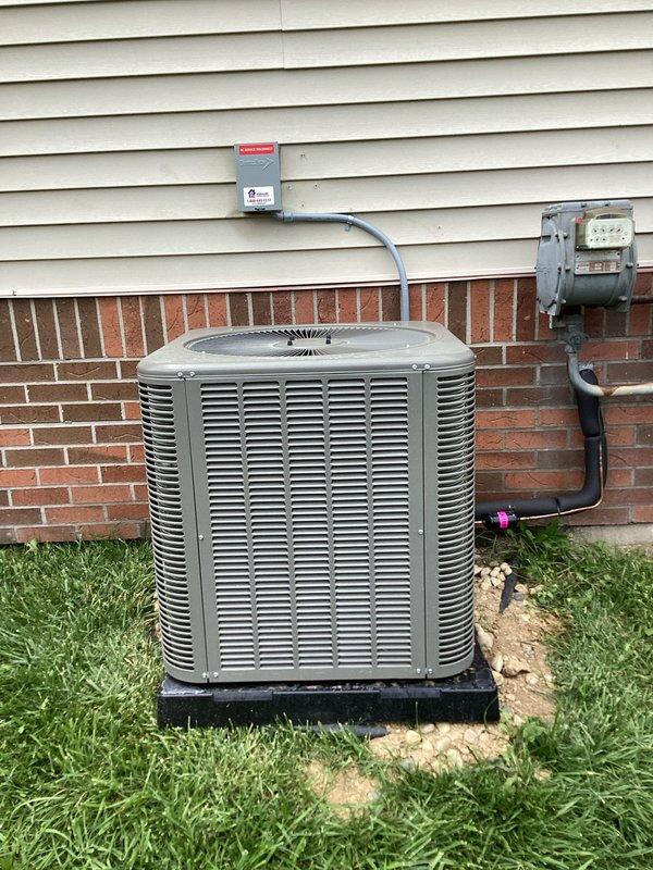 Responded to callback regarding AC disconnect installation concerns. Relocated electrical disconnect box to original mounting position to cover faded area on exterior wall. Rerouted high voltage wiring to enter through back of disconnect box instead of side entry for proper installation compliance. Applied appropriate labeling to disconnect per code requirements. Installation now meets standard specifications with improved aesthetics and proper wiring configuration.