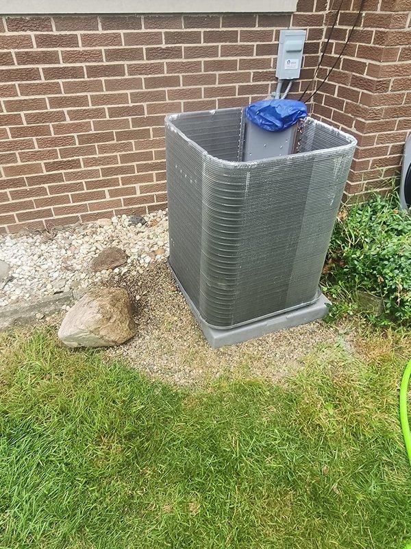 Responded to priority no-cooling call for residential air conditioning system. Upon arrival, found outdoor condenser unit with damaged protective grille bent inward, indicating possible impact or physical damage to equipment. Performed diagnostic inspection of condenser unit and refrigerant lines. Assessed compressor operation and verified copper refrigerant line connections. Protected equipment with covering during service work. System evaluated for cooling capacity restoration to ensure comfort for occupant with urgent medical needs.