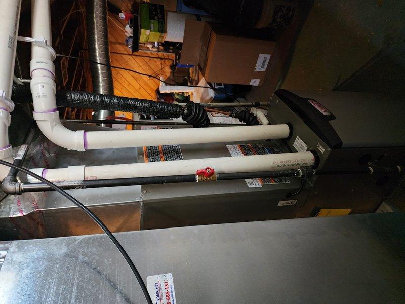 Completed full HVAC system installation including new Lennox furnace and air conditioning system. Installed air handler unit in utility area with proper ductwork connections, evaporator coil, condensate pump with PVC drainage piping, and electrical connections. System tested and operational upon completion.