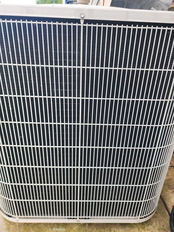 Completed routine maintenance on residential air conditioning system. Inspected outdoor condenser unit, verifying protective grille integrity and condenser coil condition. Performed indoor system inspection including compressor, refrigerant lines, drain pan, and electrical connections. All components found operating within normal parameters with no immediate service needs identified.