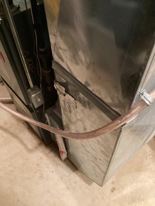 Conducted comprehensive on-site evaluation for complete HVAC system replacement after both air conditioning unit and furnace were deemed non-operational by utility company. Performed thorough inspection of existing basement-mounted furnace and outdoor condensing unit, documenting current equipment configuration, electrical panel setup with circuit breaker arrangement, and ductwork condition showing accumulated wear and dust buildup. Assessed mechanical room infrastructure including copper support strapping, junction boxes, and air handling components to determine replacement requirements and provide accurate estimate for full system installation.